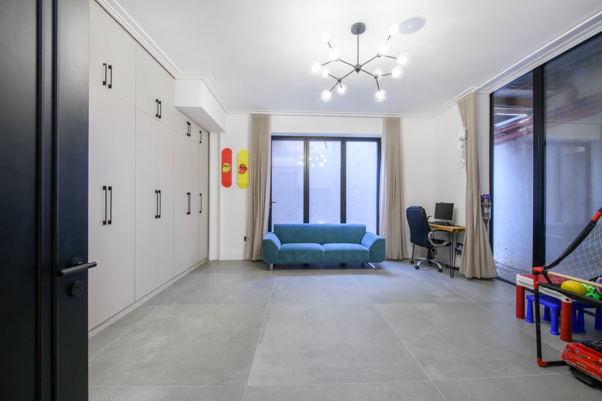A newly decorated family bathroom with tiled walls and modern fittings in North London